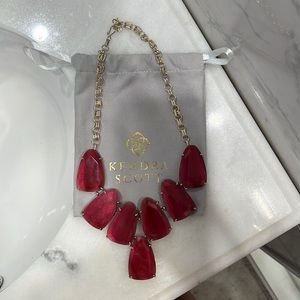 Kendra Scott statement necklace in a pink/red stone color with gold chain